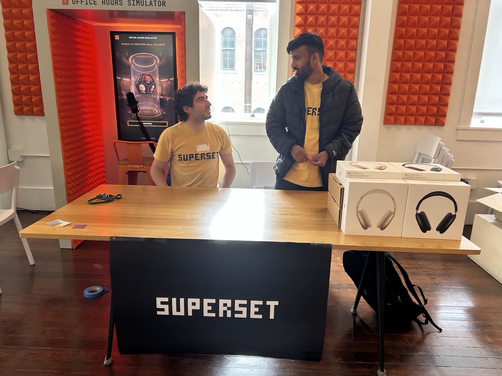 Avi and Harshith at the Superset booth at the Own Your Intelligence hackathon