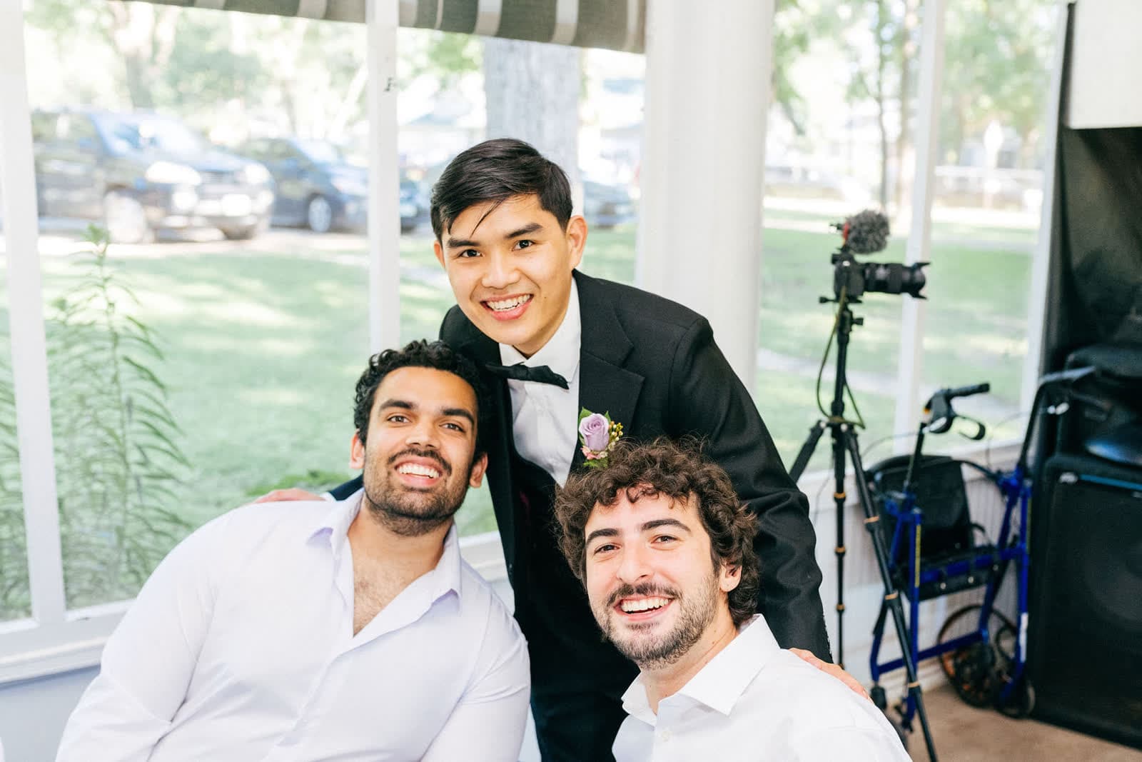 Satya and Avi with Kiet, in his wedding suit, at Kiet's wedding
