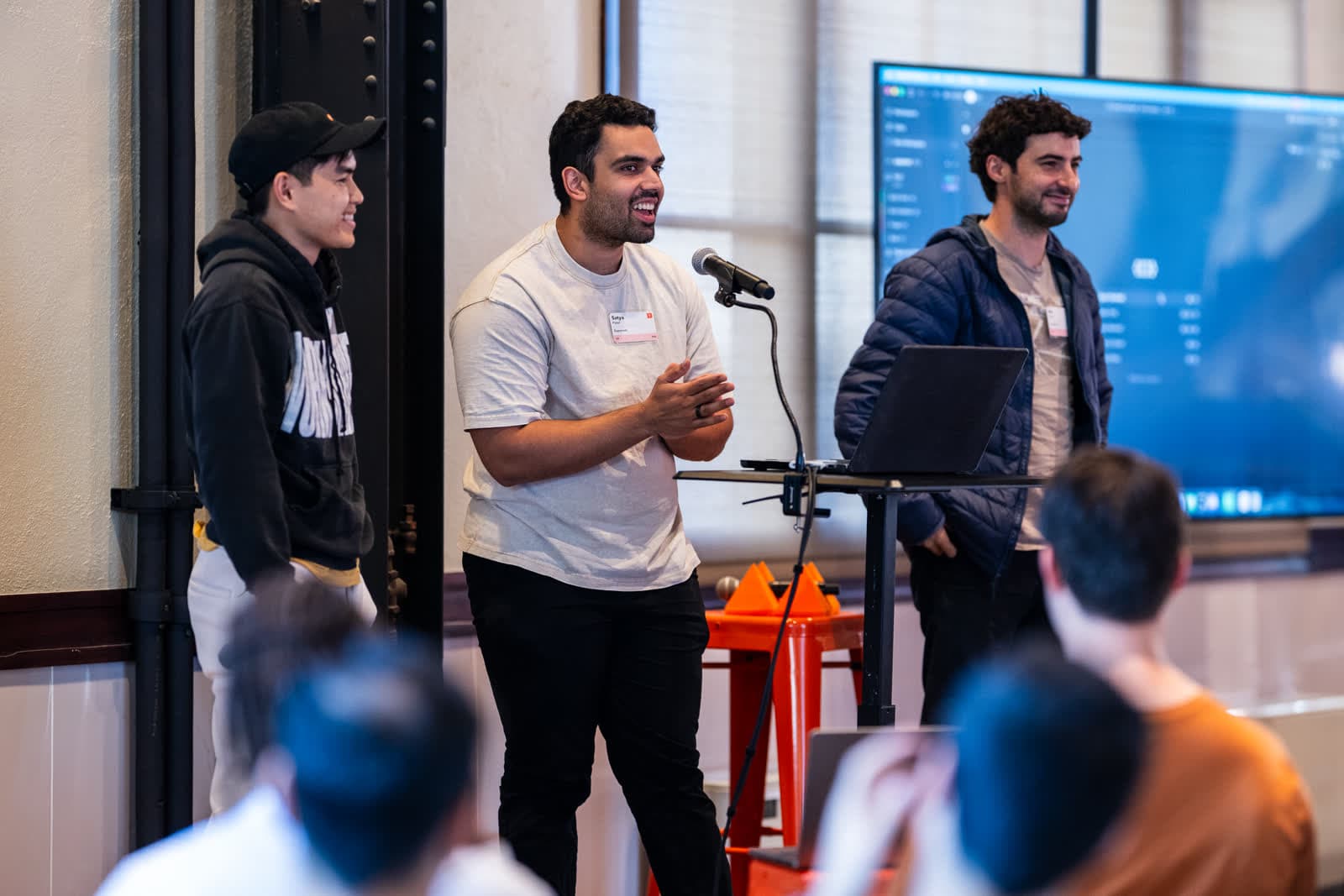 Kiet, Satya, and Avi on stage presenting Superset at a Y Combinator event